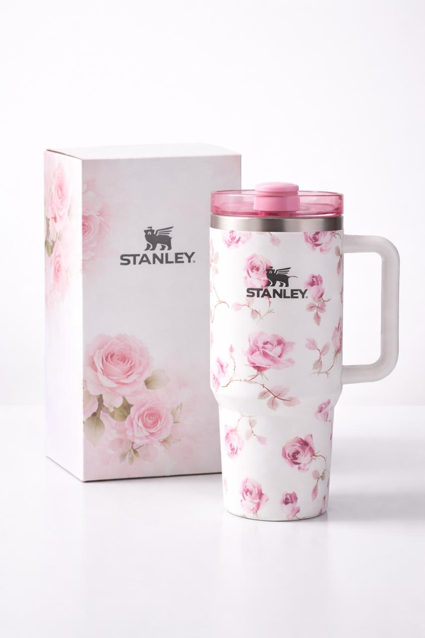 Floral-patterned Stanley mug with matching box on a white background